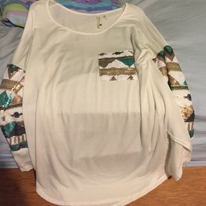 White, gold, and green long sleeve top