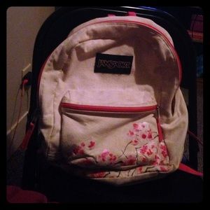 Pink white and flowery jansport backpack