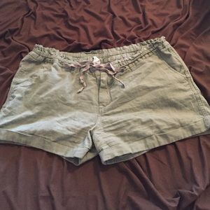 Army green linen shorts and neon coral sweater