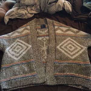 Knitted cardigan style sweater.