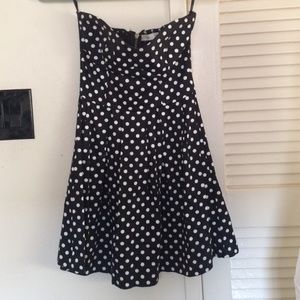 Black and white polka dot strapless dress.