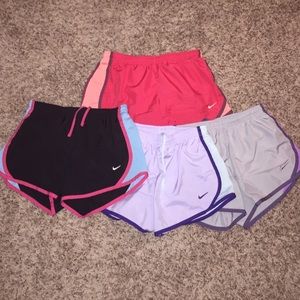 4 pairs of Nike dri fit running shorts
