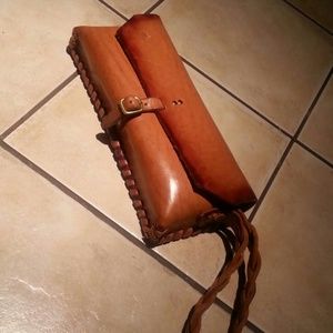 Timeless looking thick leather tan clutch/purse.