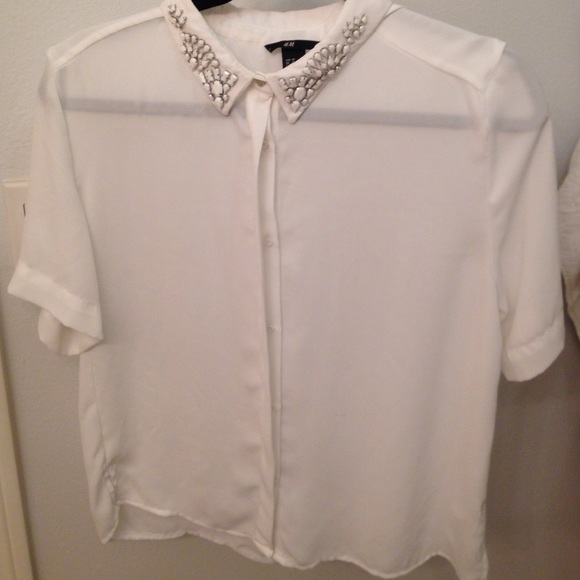 White collered top with jeweled detail