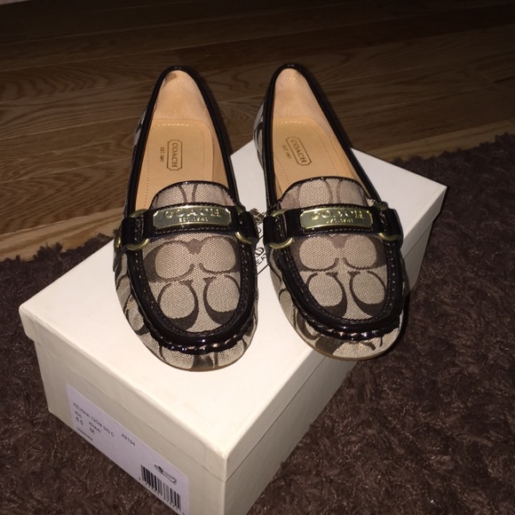 COACH khaki with gold hardware loafers.