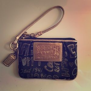 Coach Poppy black & gold Wristlet