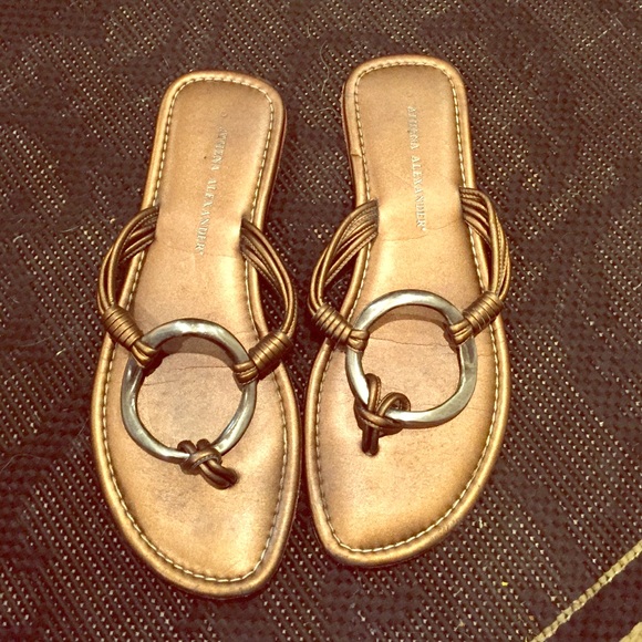 Bronze metallic flip flops with silver circle