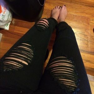 Distressed black skinny jeans