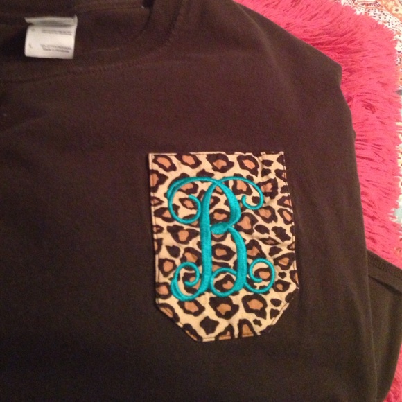 Long sleeve brown, initialed tshirt.
