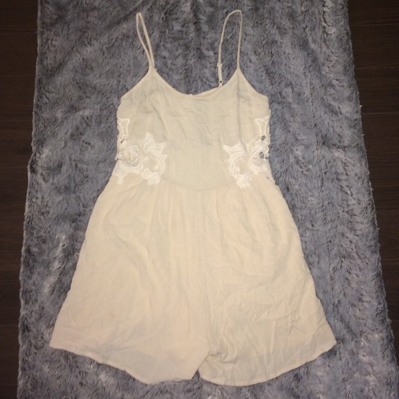 Light pink romper with lace cutout side details