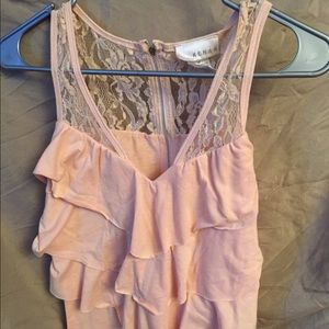 Peach colored top with lace.