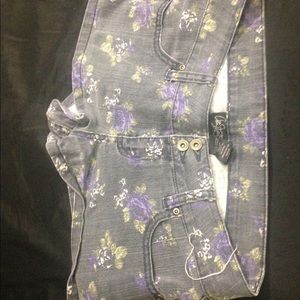 Purple roses on denim shorts