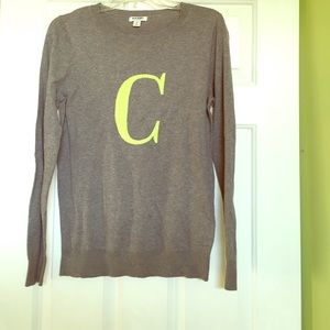 Grey sweater with initial on it