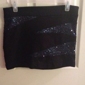 Blue sparkle and black body con skirt