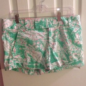 Green, white, and pink patterned shorts