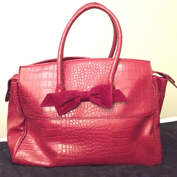 The limited red faux alligator purse with bow
