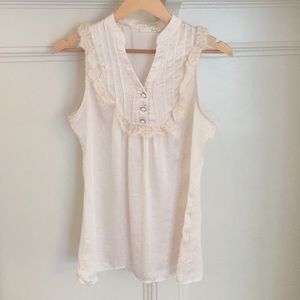 Cream silk blouse with lace detail.