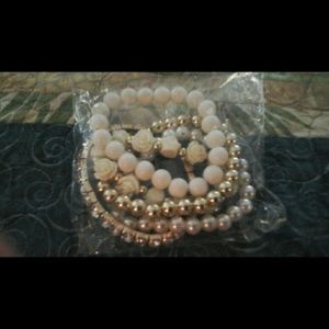 Set of cream bracelets