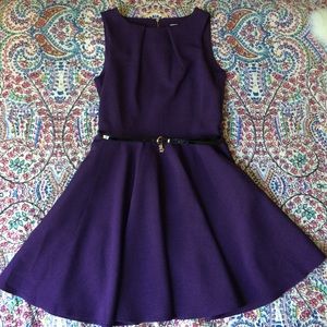Purple fit and flare dress with black belt