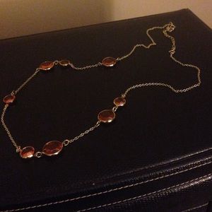 Long gold chain with orange rhinestones