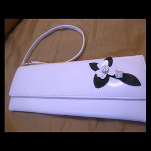 Stylish white wristlet clutch