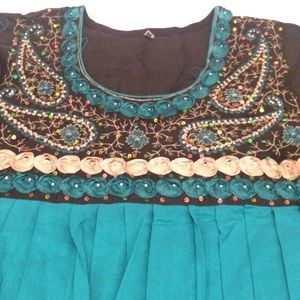 Green and black paksitani suit.