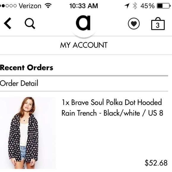 Black and white polka dot rain trench