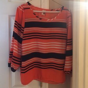 Peach orange, white and navy blue striped shirt.