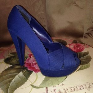 Blue fabric peep toe pumps.