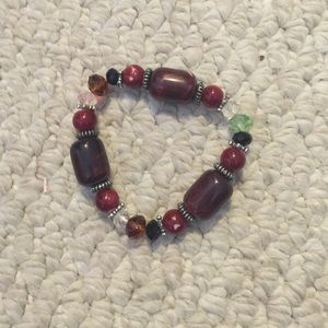 Maroon/red bracelet.