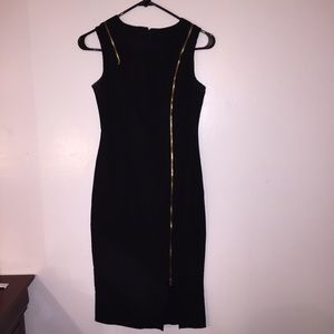 Black and gold zipper dress.