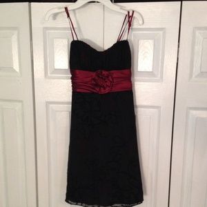 Black dress with red ribbon