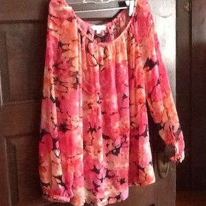 Sheer, floral blouse.