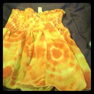 A orange sleeve less blouse