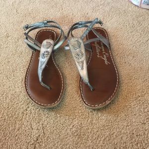 Metallic silver and leather sandals.