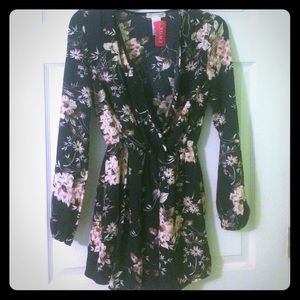 Brand new Long Sleeved Navy Floral Romper