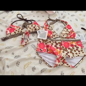 One short and two bikini tops swim suit