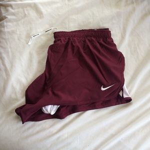 maroon/white nike dri-fit running shorts