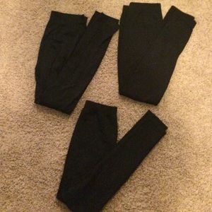 Three pairs of fleece leggings