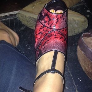Red snakeskin print stilettos