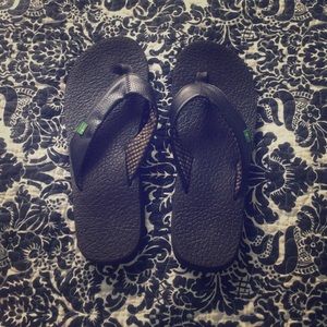 Black Sanuk flip flops