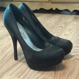 Black satin pumps