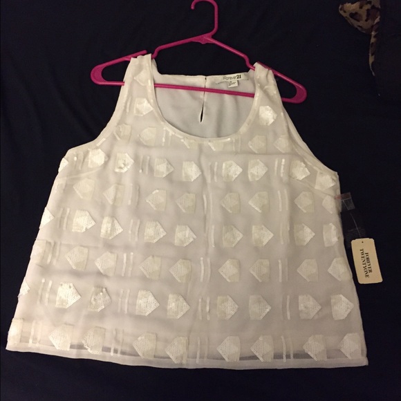 White sequined blouse.