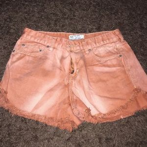 Free People burnt orange denim shorts.