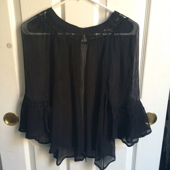 Sheer black top with open back