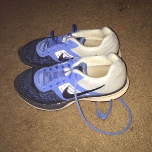 Ligh blue and navy Nike running shoes.