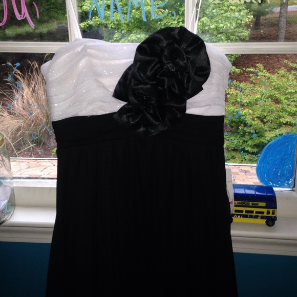 Black and white strapless dress.