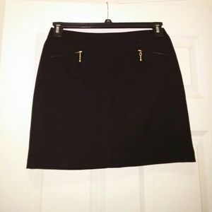 Black skirt with gold zipper detail