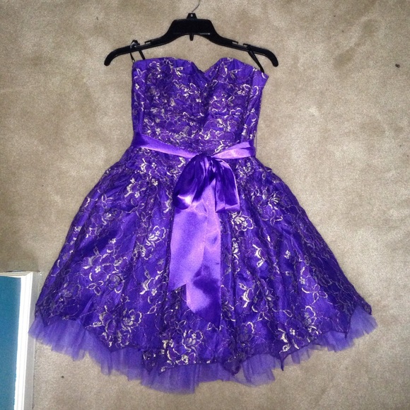 Purple strapless dress with gold floral design.