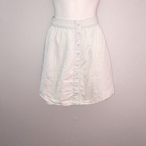 Stretchy light blue skirt with buttons